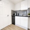 Photo 5: Fridge freezer, toaster, kettle, microwave and induction plug in hob provided.