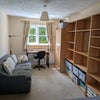 Photo 7: Room 2: Sofa, optional desk area with chair, wardrobe. Room for 2 optional clothes rails alongside.