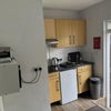 Photo 4: Kitchen, induction hob, washing machine, dinning table and chaird