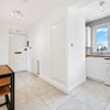Photo 2: hallway and small dining area and kitchen