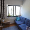 Photo 3: Room with sofa set up for daytime use