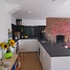 Photo 7: Open plan kitchen with compact fridge, freezer, dishwasher and microwave