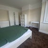 Photo 12: Larger front bedroom