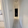 Photo 3: New marble-effect tiled flooring throughout the hallway