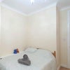 Photo 9: Small Bedroom bed