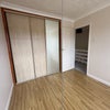 Photo 2: Built is wardrobe in larger bedroom