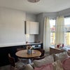 Photo 1: Living Room + Kitchen (lots of storage)