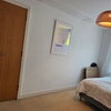 Photo 7: Bedroom with storage cupboard 