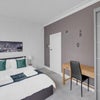Photo 2: Bedroom with desk, chair and wardrobe