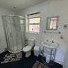 Photo 6: Power shower, radiator in large en-suite
