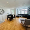 Photo 2: Openplans lounge and dining area