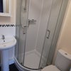 Photo 3: Clean and modern en suite with shower, sink, toilet and heated towel rail