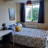 Photo 2: Comfy bed, wardrobe, chest of drawers this room is on the first floor overlooking the garden