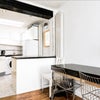 Photo 2: Reception/kitchen