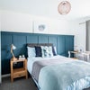 Photo 2: A bright homely room