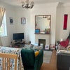 Photo 6: Living area with two sofas, three windows and fireplace