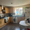 Photo 5: Spacious kitchen area with room for bikes. Washing machine, fridge freezer, microwave