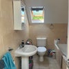 Photo 8: Tidy bathroom with window and shower/bath