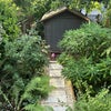 Photo 3: Garden leading out to shed. River behind. 