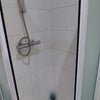 Photo 9: Fully tiled ‘Jack & Jill’ ensuite  with shower cubicle, basin  and toilet 