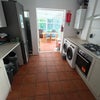 Photo 4: Kitchen and communal area