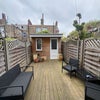 Photo 9: Backyard /washing room 