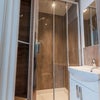 Photo 3: Room 1 - en-suite with custom built-in storage, shower, vanity unit, heated towel rail