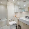 Photo 6: Bathroom with Bath/Shower and Washer/Dryer