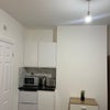 Photo 4: Fridge freezer, toaster, kettle, microwave and induction plug in hob provided.