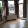 Photo 9: Room 1 street side window and balcony