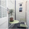 Photo 6: Patio access from Bedroom and Kitchen