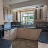 Photo 3: The kitchen has storage for each room