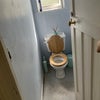 Photo 9: Toilet, door to the right of shower/bath