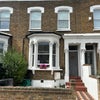 Photo 8: House Front
