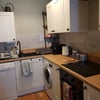 Photo 5: Kitchen with induction hob, oven, microwave, dishwasher, washing machine, built in fridge freezer