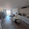 Photo 5: Living-room and kitchen from the entrance