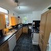 Photo 6: There is a seperate utility with washing machine and tumble dryer plus lots of storage