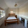 Photo 8: Bedroom and a desk