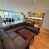 Photo 5: Large lounge area boasting u-shaped cinema hangout