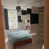 Photo 2: Soft close cupboards in bedroom provide plenty of storage 