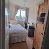 Photo 4: Single bed room with desk and wardrobe. 