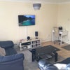 Photo 2: Sitting room with computer desk 