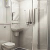 Photo 3: Bathroom (it comes with a key spray if you use one)