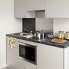 Photo 4: Small functional kitchen with fridge and microwave and 2 induction hobs