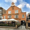 Photo 9: View from the street - entry just to the right of the restaurant