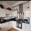 Photo 2: Modern kitchen in living room
