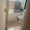 Photo 6: Beautiful modern bathroom kitted with shower-in-tub 