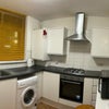 Photo 5: Kitchen including Fridge, Microwave, Washing Machine, Oven