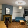 Photo 4: Living Room currently is furnished with double bed, but is not present in this picture.