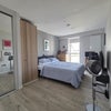 Photo 2: Room is furnished with a king sized bed and two night stands